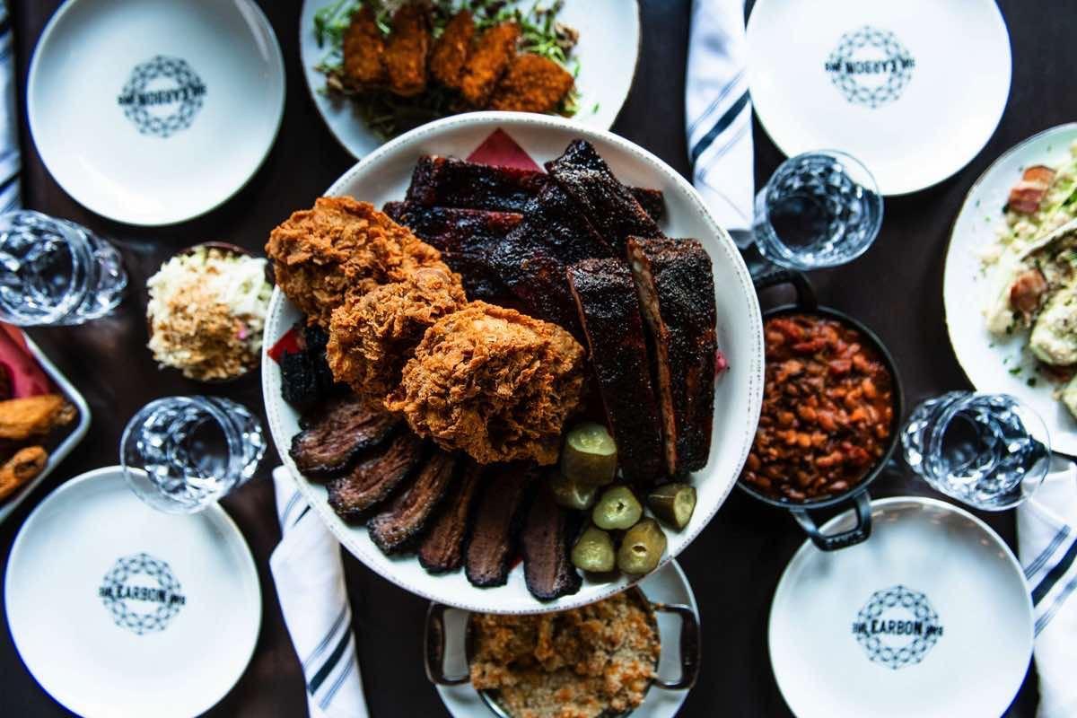 Carbon Bar sides — cornbread, slaw, fries, and sauces